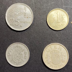 Lot of old Spanish coins, lot of 4 coins, one hundred pesetas, twenty-five pesetas, five pesetas, and one peseta... Numismatics