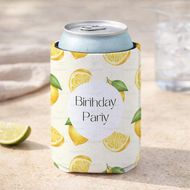 May include: A white can cooler with a lemon slice pattern and the words "Birthday Party" on a white circle. A light blue can sits inside the cooler. A lime wedge is in the foreground.