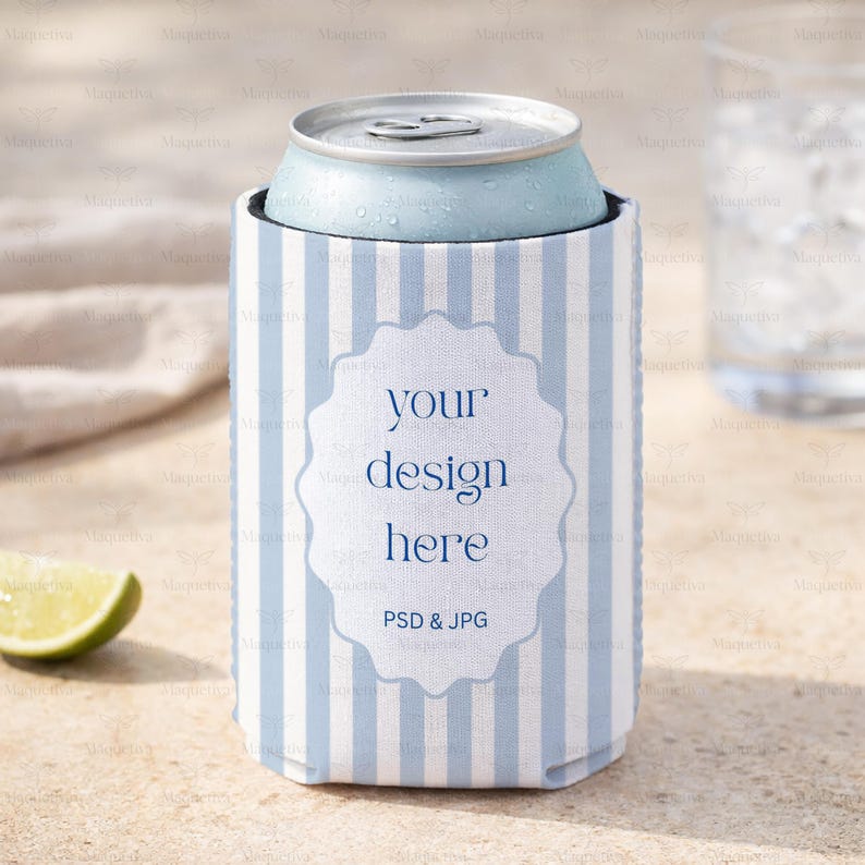 May include: A light blue can of soda in a striped blue and white can cooler. The cooler has a white label with the text "your design here" and "PSD & JPG". The can and cooler are on a light-colored surface.