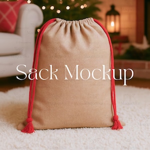 May include: A tan drawstring sack with red drawstrings and tassels. The text "Sack Mockup" is printed on the front of the sack. The sack is sitting on a white rug.