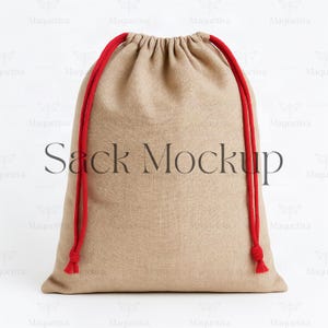 May include: A beige drawstring sack with red rope ties. The words "Sack Mockup" are printed in the center of the bag. The bag is made of a textured fabric.