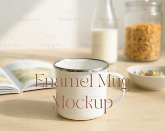 May include: A white enamel mug with a silver rim and handle, with the words "Enamel Mug Mockup" in brown text. The mug is on a light wooden surface, with a bottle of milk, a jar of cereal, and a bowl of colorful candies in the background.