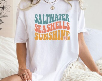 Camiseta con conchas marinas y sol, camiseta retro para viajes a la playa