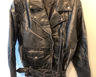 May include: Black leather motorcycle jacket with a belted waist and zippered pockets.