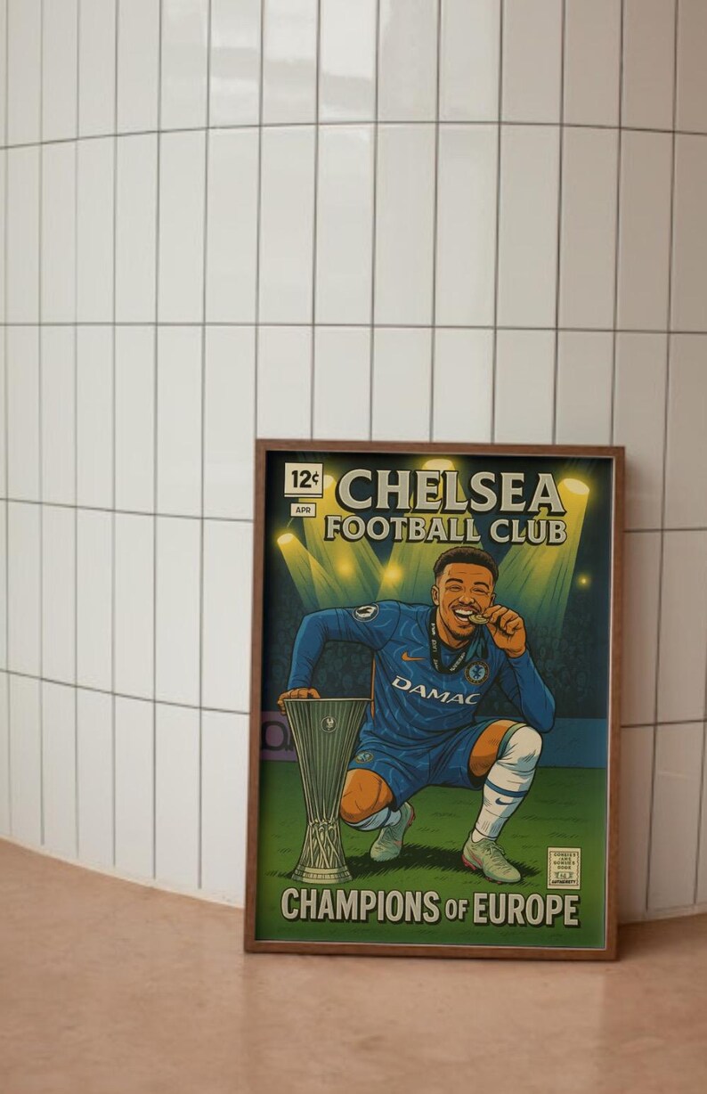May include: A framed print in a comic book style, depicting a Chelsea Football Club player celebrating a win. The player wears a blue kit, holding a medal and the trophy. The print includes the text "CHELSEA FOOTBALL CLUB" and "CHAMPIONS OF EUROPE".