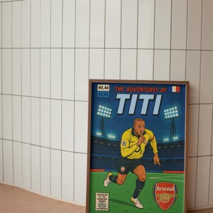 May include: A comic book cover featuring a cartoon illustration of a soccer player in a yellow and blue jersey with the text "The Adventures of Titi" and "Arsenal" on the cover.