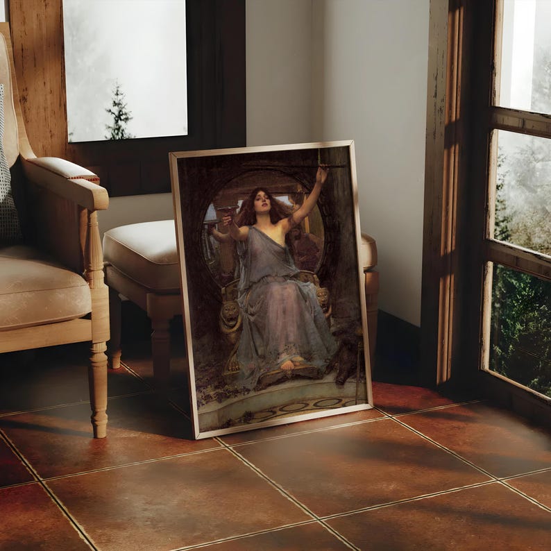 May include: A framed print of a classical painting depicting a woman in a flowing gown, seated on a throne. The artwork features muted tones of blue, brown, and gold. The print is leaning against a wall in a room with a window.