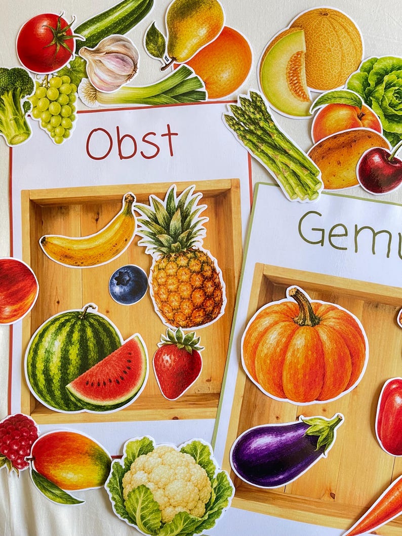 May include: Educational charts featuring colorful illustrations of various fruits and vegetables. The left chart is labeled Obst and displays a banana, pineapple, blueberry, strawberry, watermelon, and mango. The right chart is labeled Gemu.