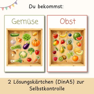 May include: Two educational cards labeled Du bekommst, Gemuse, and Obst. One card shows illustrations of vegetables in a wooden crate, the other shows fruits. Below, the text reads 2 Losungskartchen (DinA5) zur Selbstkontrolle. The cards are white.