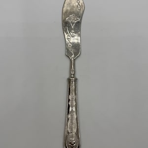Vintage Silver-Tone Butter Knife with Intricate Floral and Geometric Handle Design