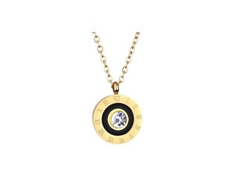May include: Gold-tone necklace with a circular pendant. The pendant features a black center with a clear, sparkling stone and is surrounded by a gold ring with Roman numerals. The necklace chain is also gold-toned.