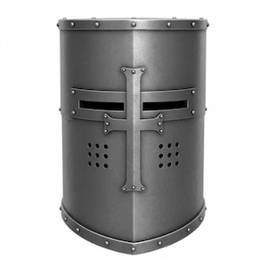 May include: A silver-coloured, medieval knight's helmet. The helmet has a cross design on the front, with horizontal eye slits and ventilation holes. Rivets secure the metal plates. The helmet is a cylindrical shape.