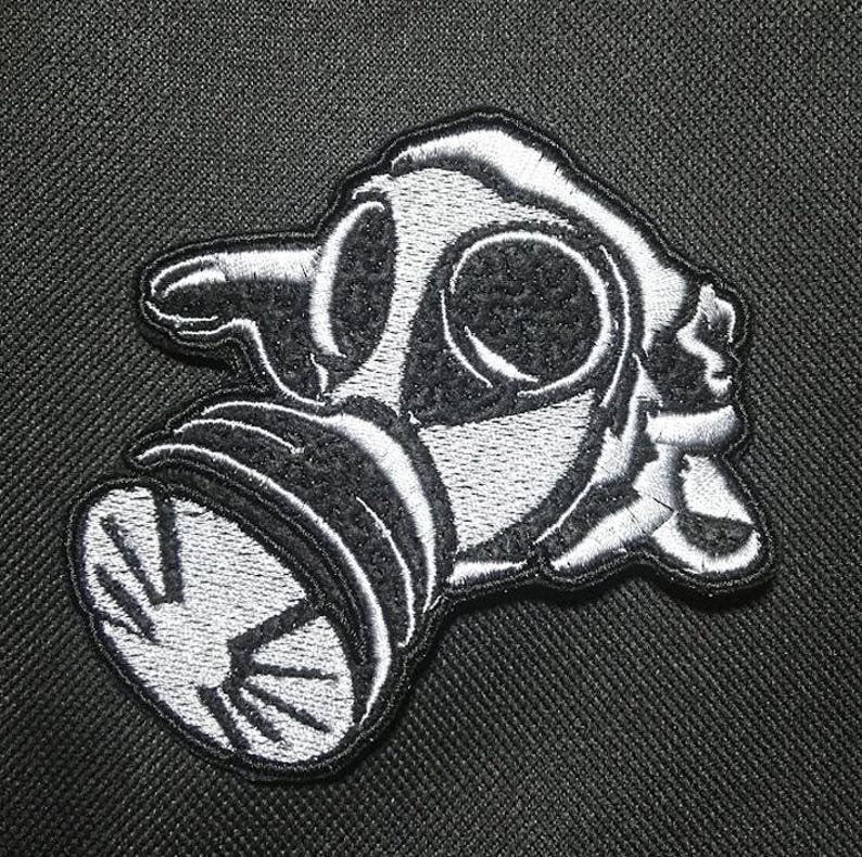 May include: A set of three ceramic mugs with a speckled, matte finish. The mugs are in shades of cream, light gray, and dark gray. Each mug has a simple, minimalist design, perfect for coffee or tea.