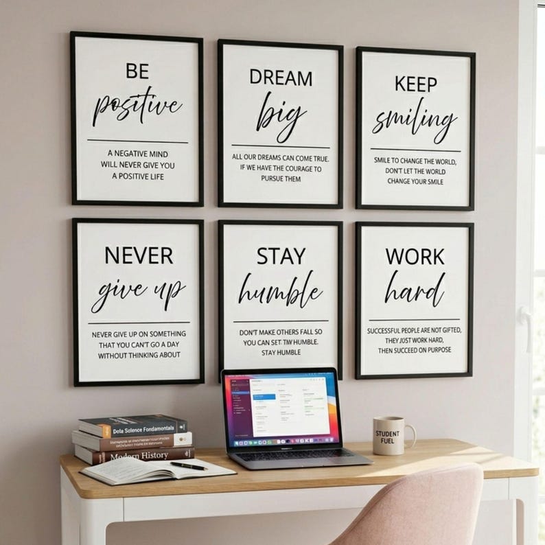 May include: Six framed wall art prints with black frames and white backgrounds, each featuring motivational text in black serif and script fonts. The prints display phrases like Be Positive, Dream Big, Keep Smiling, Never Give Up, Stay Humble, and Work Hard.