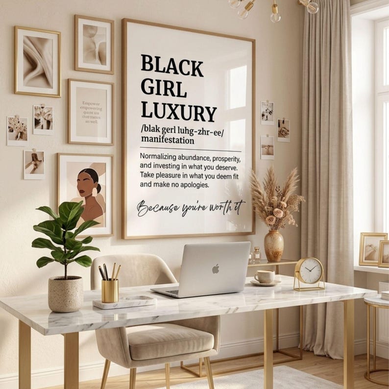 May include: A large framed wall art print featuring the text BLACK GIRL LUXURY, a phonetic pronunciation, and a definition about normalizing abundance and prosperity, ending with the script text Because you're worth it, displayed in a home office.