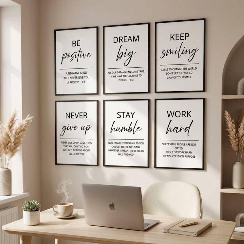 May include: A set of six rectangular wall art prints with black frames, each featuring white backgrounds and black text. The prints display motivational phrases including Be Positive, Dream Big, Keep Smiling, Never Give Up, Stay Humble, and Work Hard.