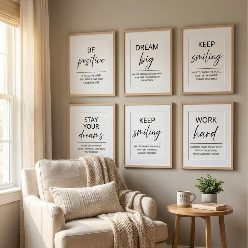 May include: Six framed wall art prints with light wood frames, each featuring white backgrounds and black text with motivational quotes including Be Positive, Dream Big, Keep Smiling, Stay Your Dreams, and Work Hard, arranged in two rows of three.