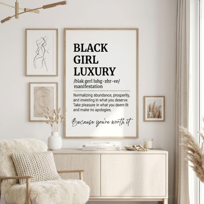 May include: A vertical wall art print featuring the text BLACK GIRL LUXURY, a phonetic pronunciation, and a definition about abundance and prosperity. The print includes the phrase Because you're worth it in a script font on a white background.