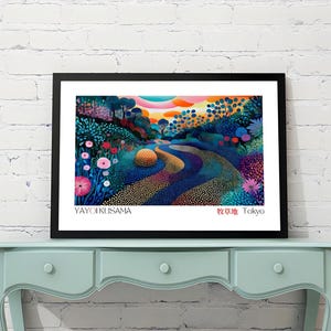 May include: A framed art print featuring a colorful landscape with a winding path. The artwork displays a vibrant array of blues, greens, pinks, and oranges. The artist's name, Yayoi Kusama, and the city, Tokyo, are printed at the bottom.