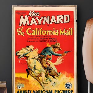 May include: Vintage film poster for "The California Mail" starring Ken Maynard. The poster shows a cowboy on horseback aiming a gun, set against a red and yellow background. Text includes the film title and production credits.