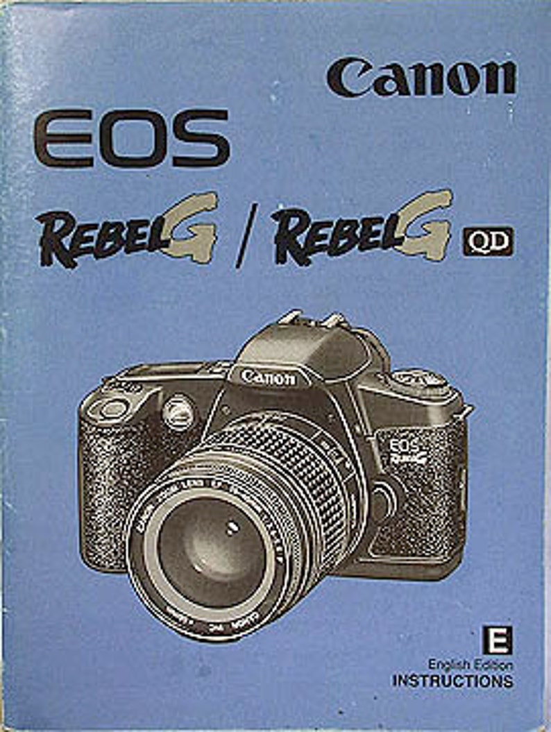May include: A blue and white instruction manual for the Canon EOS Rebel G and Rebel G QD cameras. The cover features a black and silver Canon EOS Rebel G camera with a lens attached.