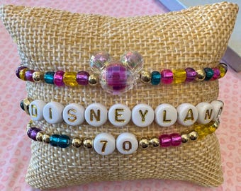 Disneyland 70th Anniversary stack.  Set of 3 seed bead bracelets with gold accents and a Mickey head bead