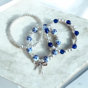 3-Bracelet Set, White Porcelain Beads with Blue Flowers, Silver Accents, and bow. Boho Jewelry, Gift for Her, Handmade Bracelet Stack
