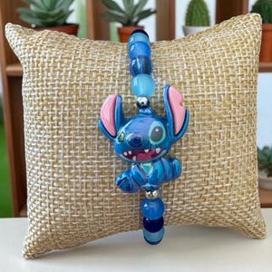Blue stitch glass bead bracelet with cute stitch charm, handmade Lilo & Stitch gift
