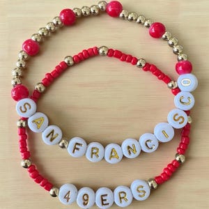 Set of 2 San Francisco 49ers seed bead bracelets.