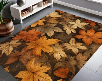 Puede incluir: Una alfombra rectangular con un diseño de hojas otoñales en tonos marrones, naranjas y beige. Las hojas están dispersas sobre un fondo marrón oscuro, creando un diseño cálido. La alfombra está colocada sobre un suelo gris.