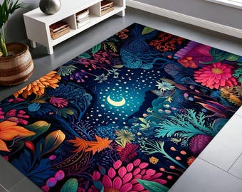 Può includere: Un tappeto colorato con un design floreale e una luna crescente al centro. Il tappeto ha uno sfondo blu scuro con fiori rosa, arancioni, gialli e verdi brillanti.