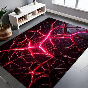 May include: A black and red area rug with a cracked lava design. The cracks are filled with a bright red glow.