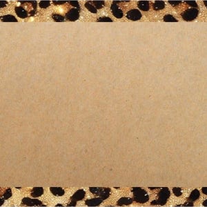 May include: A decorative card with a leopard print border and a tan centre. Black balloons and gift boxes are on the left. The border has gold glitter accents. The card is suitable for celebrations.