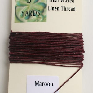 May include: A spool of 4-ply Irish waxed linen thread in maroon color. The spool contains 5 yards of thread.