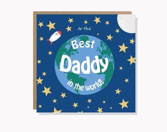 May include: A greeting card with a blue background filled with yellow stars. The card features a globe with the words "Best Daddy in the world!" and a small rocket ship.