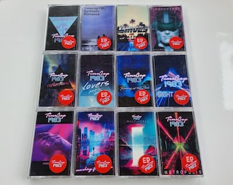 May include: A collection of twelve cassette tapes with colorful artwork. Each tape features the text "Timecop 1983" and a unique title, such as "Journeys" and "Synthetic Romance." A red circular sticker with "EP" is on each tape.