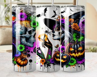 May include: Three Halloween-themed stainless steel tumblers with a spooky design. The design includes a skull, a woman with sugar skull makeup, pumpkins, bats, and flowers in vibrant colors like purple, orange, and green.