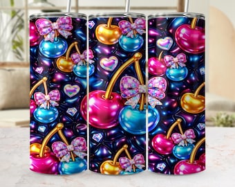 May include: A set of three stainless steel tumblers with a vibrant, repeating pattern of cherries, bows, and hearts. The cherries are in shades of pink, gold, and blue, with glittery bows and diamond accents against a dark, quilted background.
