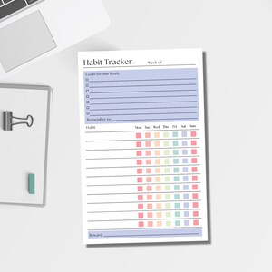 May include: A white paper habit tracker sheet with a light purple header section labeled Habit Tracker and Week of. It includes a Goals for this Week section with lines, a Remember to line, and a grid with rows for habits and columns for days of the week.