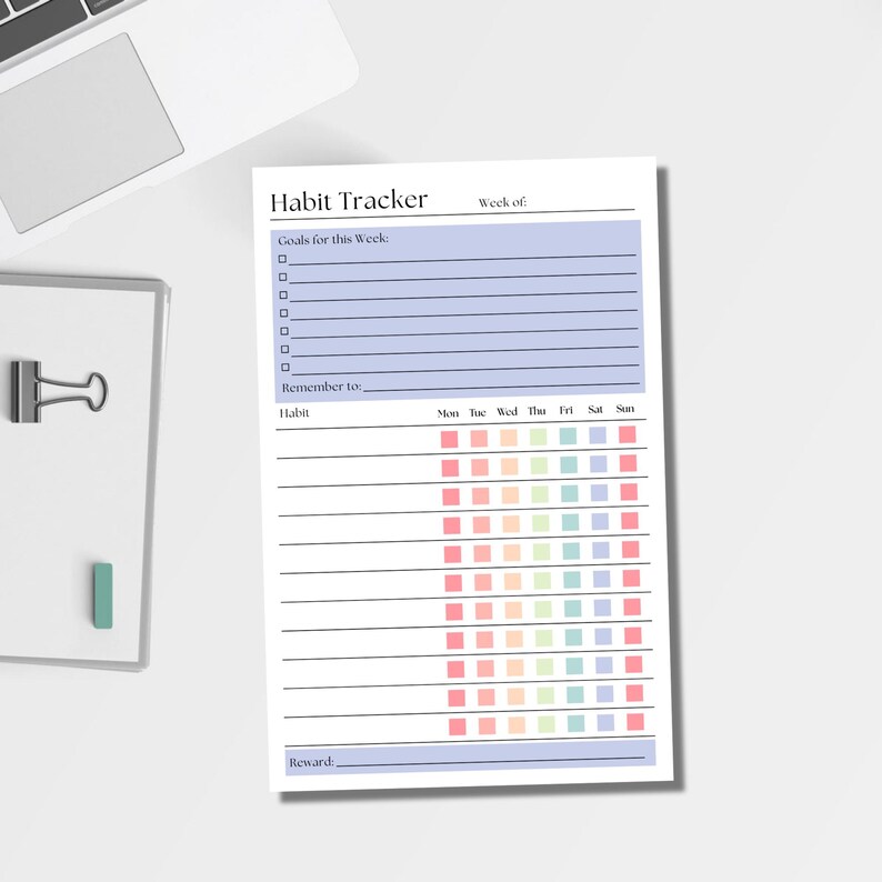 May include: A white paper habit tracker sheet with a light purple header section labeled Habit Tracker and Week of. It includes a Goals for this Week section with lines, a Remember to line, and a grid with rows for habits and columns for days of the week.