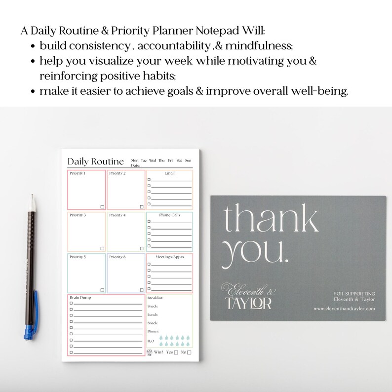 May include: A white daily routine and priority planner notepad with colorful grid sections for tasks, a brain dump area, and meal tracking. Beside it lies a black pen and a grey thank you card featuring the text Eleventh & Taylor in white font.