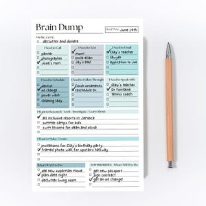 May include: A notepad titled "Brain Dump" with a wooden pencil. The notepad has sections for tasks like "I Need to Call," "I Need to Text," and "I Need to Email." The start date is June 14th. The notepad is used for organizing tasks.
