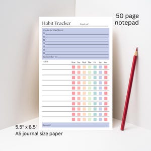 May include: A white notepad with a habit tracker layout, featuring sections for goals, reminders, and a weekly habit chart. The notepad is 5.5" x 8.5" and includes a red pencil. The text "Habit Tracker" and "50 page notepad" are visible.