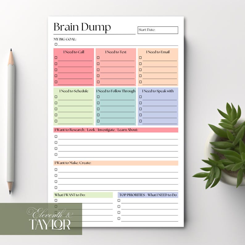 May include: A white Brain Dump notepad with colorful sections for tasks like calling, texting, and emailing. The notepad includes sections for scheduling, research, and priorities. A pencil and a small plant are visible.