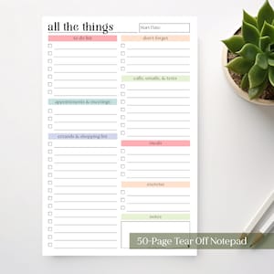 May include: A white notepad with the text "all the things" at the top. The notepad has sections for to-do lists, appointments, errands, and more. The notepad has a 50-page tear-off design.