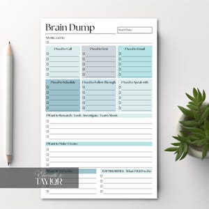 May include: A white Brain Dump notepad with teal and gray sections for organizing tasks. The notepad includes sections for calls, texts, emails, scheduling, and research. A gray pencil and a small potted plant are on the side.