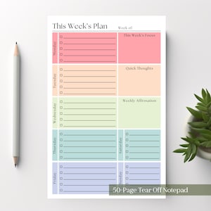 May include: A 50-page tear-off notepad titled This Week's Plan with sections for each day of the week. The planner features colour-coded blocks in pink, orange, light green, blue, and purple, each containing checkboxes and lines for daily tasks.