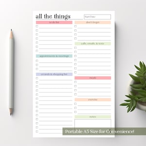 May include: A white A5 size notepad with the text "all the things" at the top. The notepad has sections for to-do lists, appointments, errands, meals, exercise, and notes. A pencil is on the left.