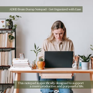 May include: A woman sits at a wooden desk with a laptop, surrounded by plants and stationery. The text at the top reads "ADHD Brain Dump Notepad - Get Organized with Ease." The text at the bottom says, "This notepad is specifically designed to support a more productive and purposeful life."