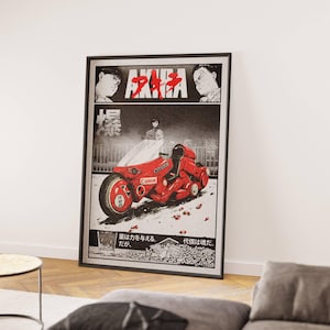 May include: Framed poster featuring a manga-style illustration. The artwork showcases a red motorcycle with the word "Canon" on it, set against a black and white background. The title "AKIRA" is displayed at the top.